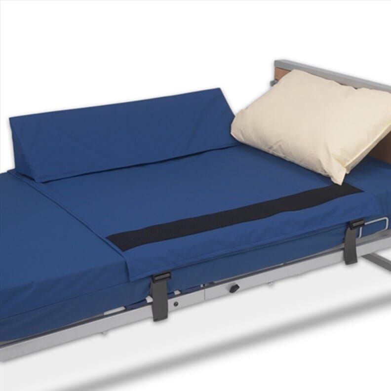 Cales latérales de maintien au lit